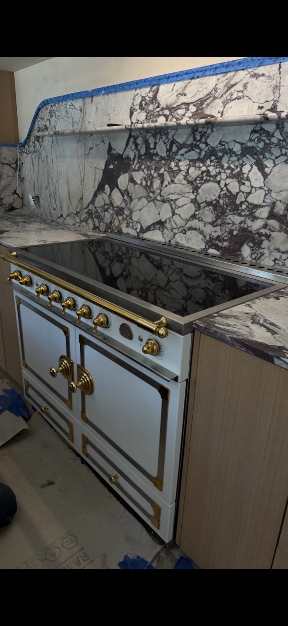 Luxury range and marble cooktop installation